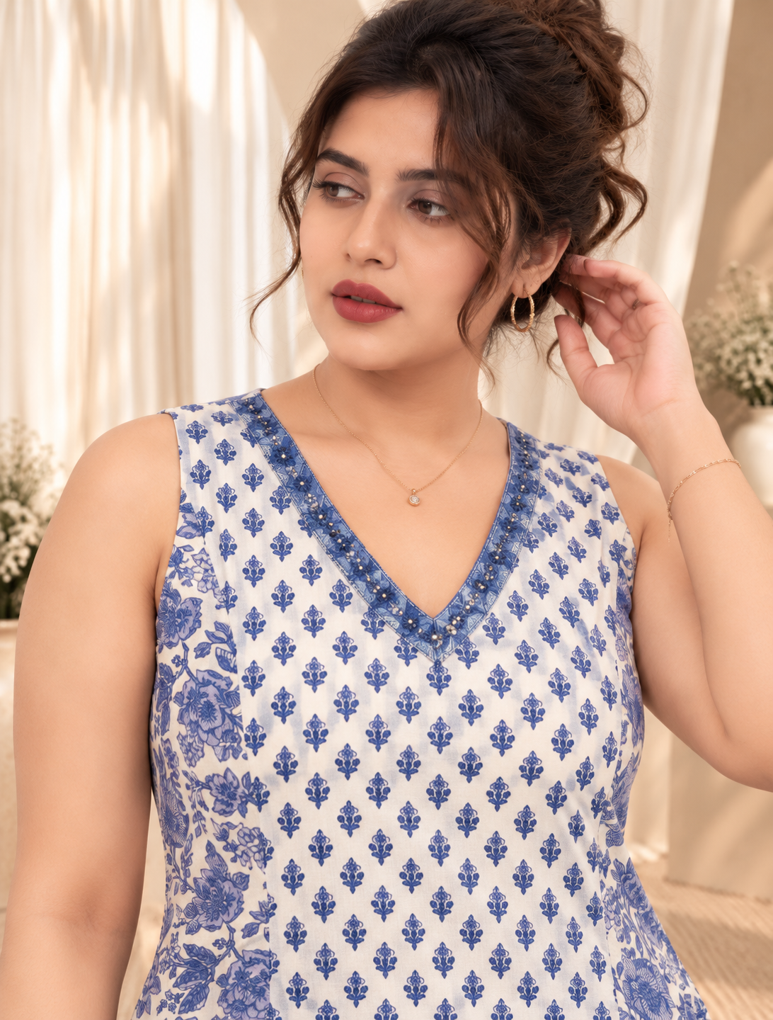 Women's White & Blue Floral Printed Sleeveless Flared Peplum Top